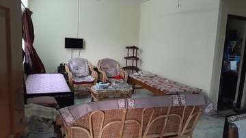 Living Room in 2 BHK Apartment at Charms Residency CHS, Brahmand – for Sale