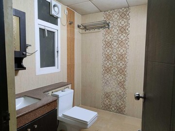 Bathroom in 3 BHK Apartment at Purvanchal Royal Park, Sector 137 – for Rent