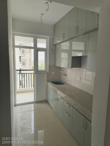 Kitchen in 2 BHK Apartment at Ajnara Panorama Facing F1, Sector 22 Yamuna Expressway – for Rent