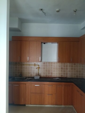 Kitchen in 2 BHK Apartment at Mahagun Mywoods, Sector 16c Greater Noida – for Rent