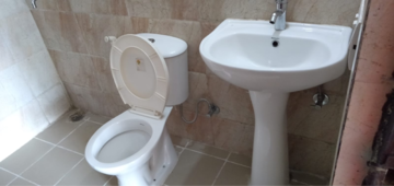 Bathroom in 2 BHK Apartment at Ajnara Le Garden, Panchsheel Green – for Rent