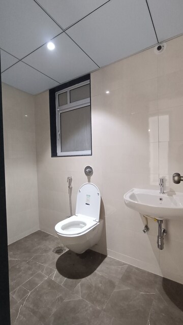 Bathroom in 3 BHK Apartment at Jhamtani Ace Abode, Kiwale – for Sale