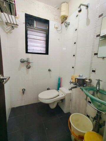Bathroom in 2 BHK Apartment at Manshanti CHS, Borivali West – for Sale