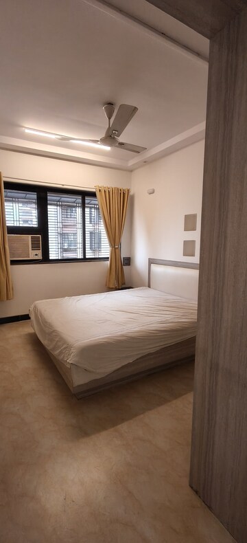 Bedroom in 2 BHK Apartment at Indradarshan II, Oshiwara – for Rent