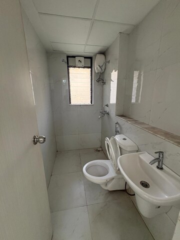 Bathroom in 1 BHK Apartment at Runwal Gardens Phase I, Dombivli East – for Rent