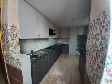 Kitchen in 4 BHK Apartment at Mahagun Mezzaria, Sector 78 – for Rent