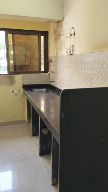 Kitchen in 1 BHK Apartment at Vighnahatra Modern Enclave, Agripada – for Sale