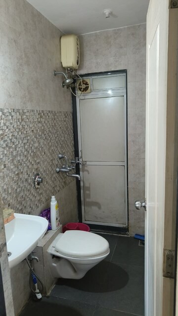 Bathroom in 1 BHK Apartment at Raunak Heights, Ghodbunder Road – for Rent