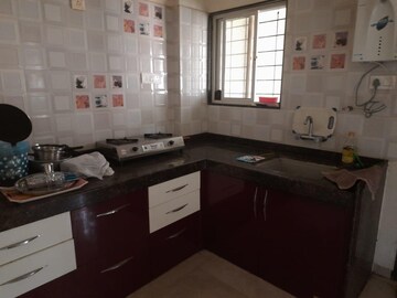 Kitchen in 2 BHK Apartment at Nirman Nisarga, Bhusari Colony – for Rent