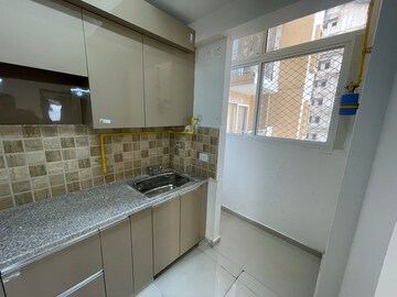Kitchen in 2 BHK Apartment at Amrapali Golf Homes, Sector 4 Greater Noida – for Rent