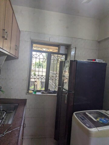 Kitchen in 1 BHK Apartment at Varsha CHS, Andheri West – for Sale