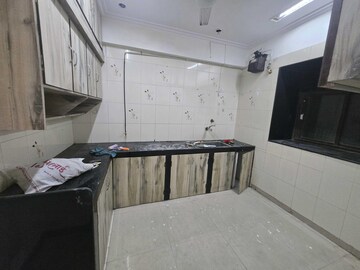 Kitchen in 2 BHK Apartment at Andheri CHS, Andheri West – for Rent