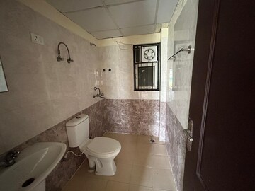 Bathroom in 2 BHK Apartment at Gardenia Golf City, Sector 75 – for Sale