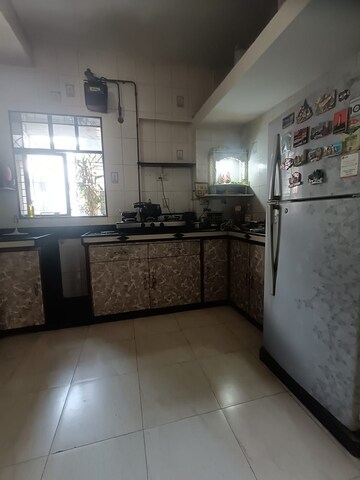 Kitchen in 2 BHK Apartment at Brindaban Mathura CHS, Vrindavan Society – for Sale