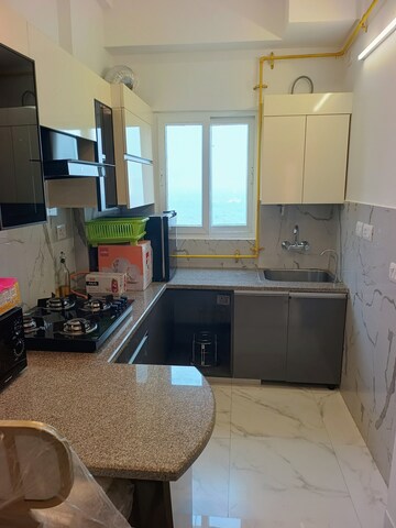 Kitchen in Studio Apartment at Purvanchal Royal Square, Chi V Greater Noida – for Rent