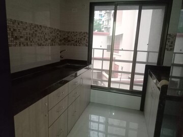 Kitchen in 2 BHK Apartment at Andheri CHS, Andheri West – for Rent