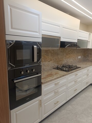 Kitchen in 4 BHK Builder Floor at Ansal API Esencia, Sector 67 – for Sale