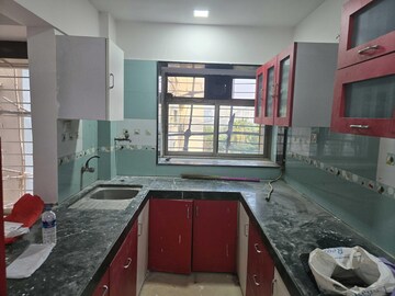 Kitchen in 2 BHK Apartment at Parijat CHS Andheri West, Yari Road – for Rent