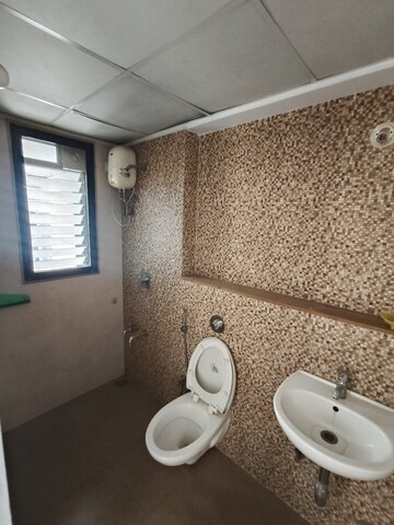 Bathroom in 1.5 BHK Apartment at Lodha Lakeshore Greens, Dombivli East – for Rent