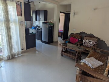 Living Room in 2 BHK Apartment at Aims Golf City, Sector 75 – for Rent
