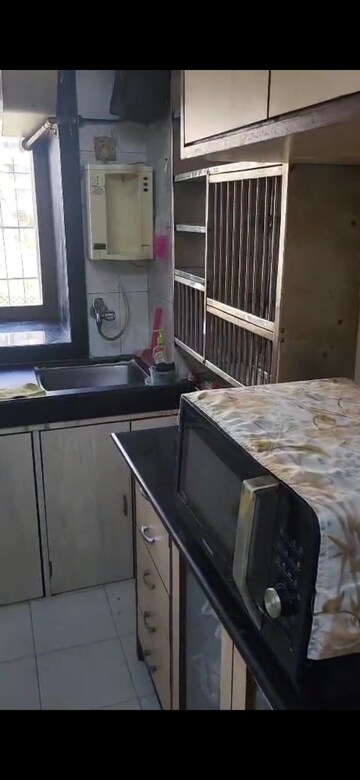 Kitchen in 2 BHK Apartment at Dheeraj Pooja, Malad West – for Rent