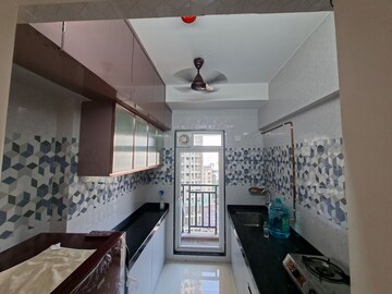 Kitchen in 1 BHK Apartment at Raunak Bliss B2, Ghodbunder Road – for Rent