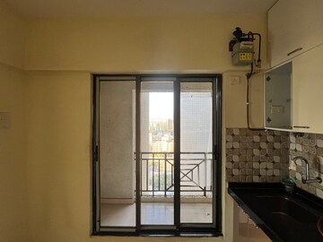 Kitchen in 2 BHK Apartment at Sunshine Tower, Asha Nagar – for Rent