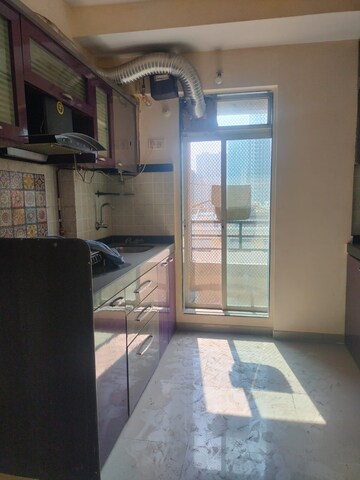 Kitchen in 1 BHK Apartment at Mahavir Kalpavruksha, Ghodbunder Road – for Rent