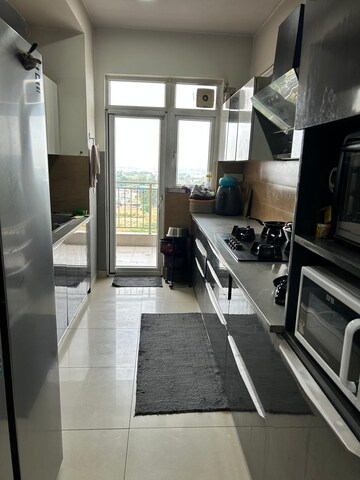 Kitchen in 3.5 BHK Apartment at Emaar Palm Gardens, Sector 83 – for Rent