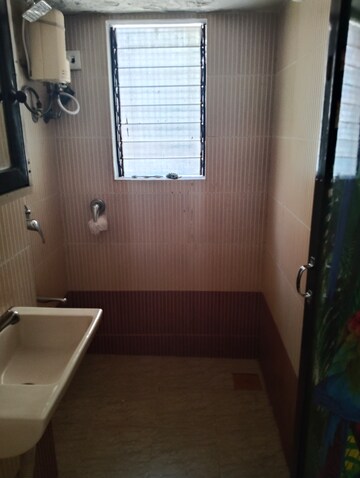 Bathroom in 1 BHK Apartment at Veena Nagar CHS, Mulund West – for Rent