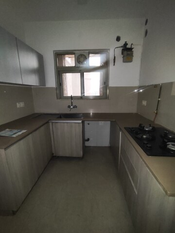 Kitchen in 2 BHK Apartment at Hiranandani Woodpark Apartment, Ghodbunder Road – for Rent