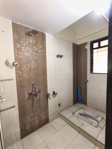 Bathroom in 2 BHK Apartment at Puranik City, Kasarvadavali – for Rent