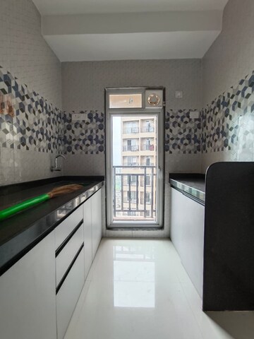 Kitchen in 1 BHK Apartment at Raunak Bliss B1, Ghodbunder Road – for Rent