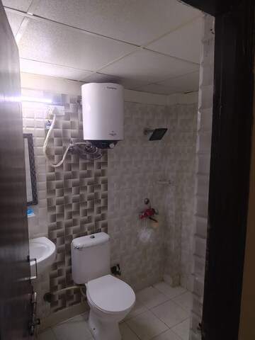 Bathroom in 2 BHK Apartment at Aims Golf City, Sector 75 – for Rent