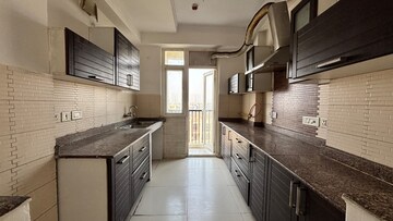 Kitchen in 3.5 BHK Apartment at Apex The Rio, Ahinsa Khand 2 – for Sale