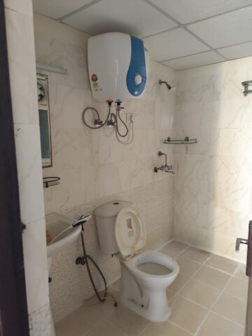 Bathroom in 2.5 BHK Apartment at Aims Golf City, Sector 75 – for Sale