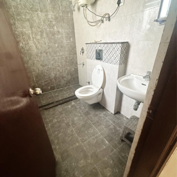Bathroom in 3 BHK Apartment at NK Sharma Savitry Greens, Vip Road – for Rent