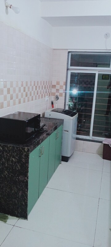 Kitchen in 2 BHK Apartment at Bindra Complex, Andheri East – for Rent