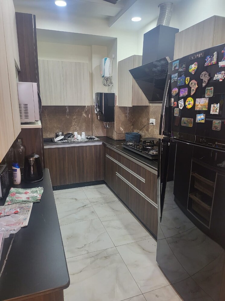 Kitchen, new palam vihar phase 1 3 Bedroom 900 Sq.Ft. Apartment In New Palam Vihar Phase 1 Gurgaon 9789088
