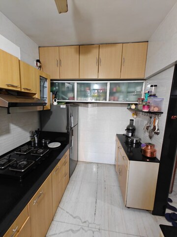 Kitchen in 2 BHK Apartment at Palash Towers, Andheri West – for Rent