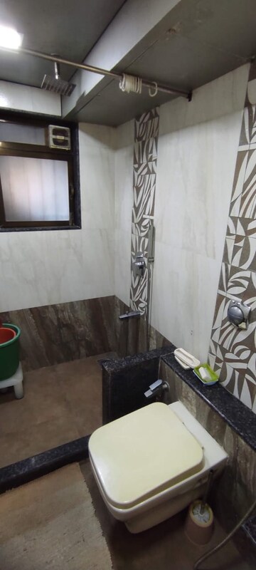 Living Room in 2 BHK Apartment at Palash Towers, Andheri West – for Rent