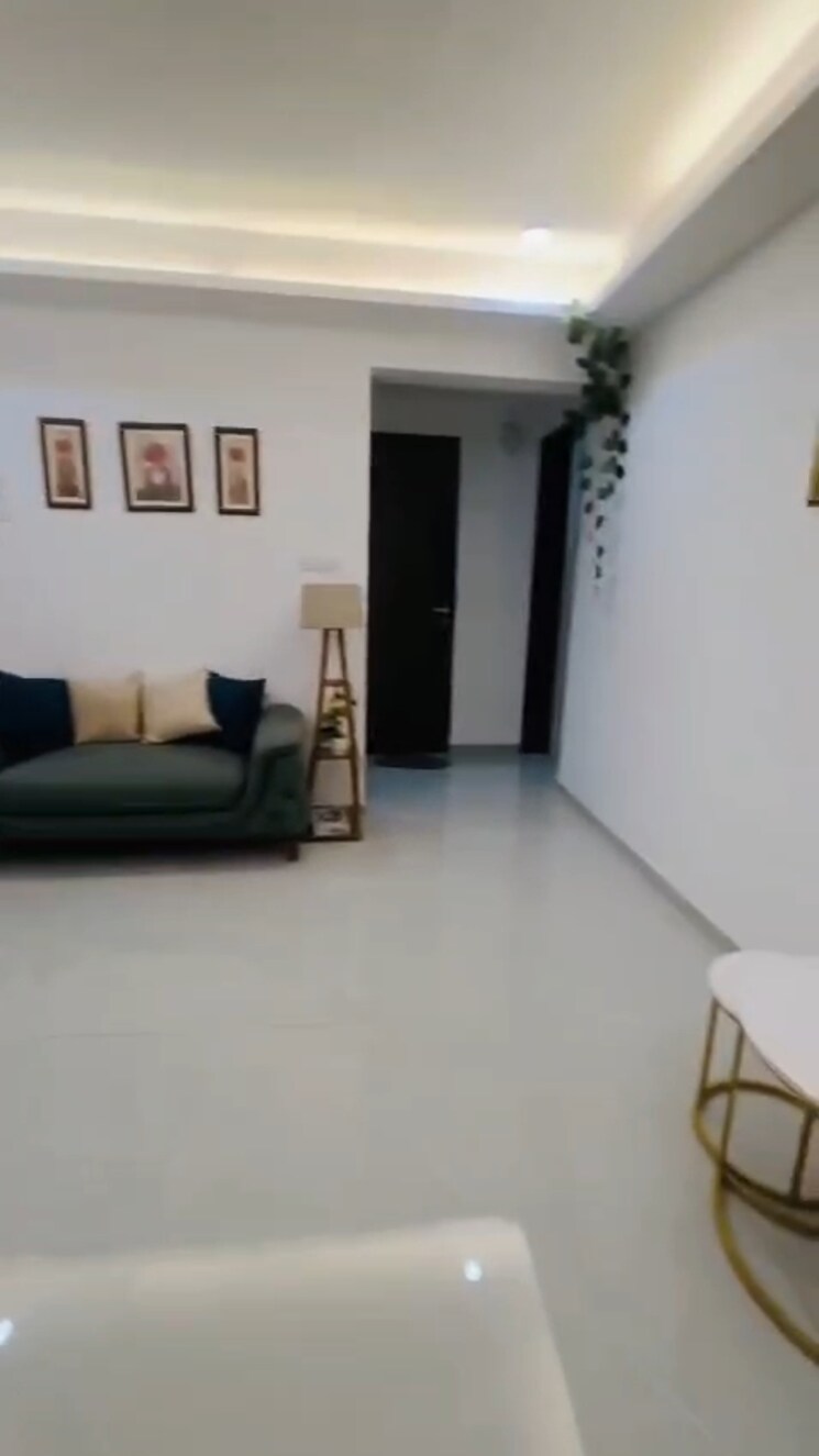 Living Room, dev-leo-tower 2 Bedroom 670 Sq.Ft. Apartment In Oshiwara Mumbai 9811073