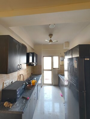 Kitchen in 2 BHK Apartment at Aims Golf City, Sector 75 – for Rent
