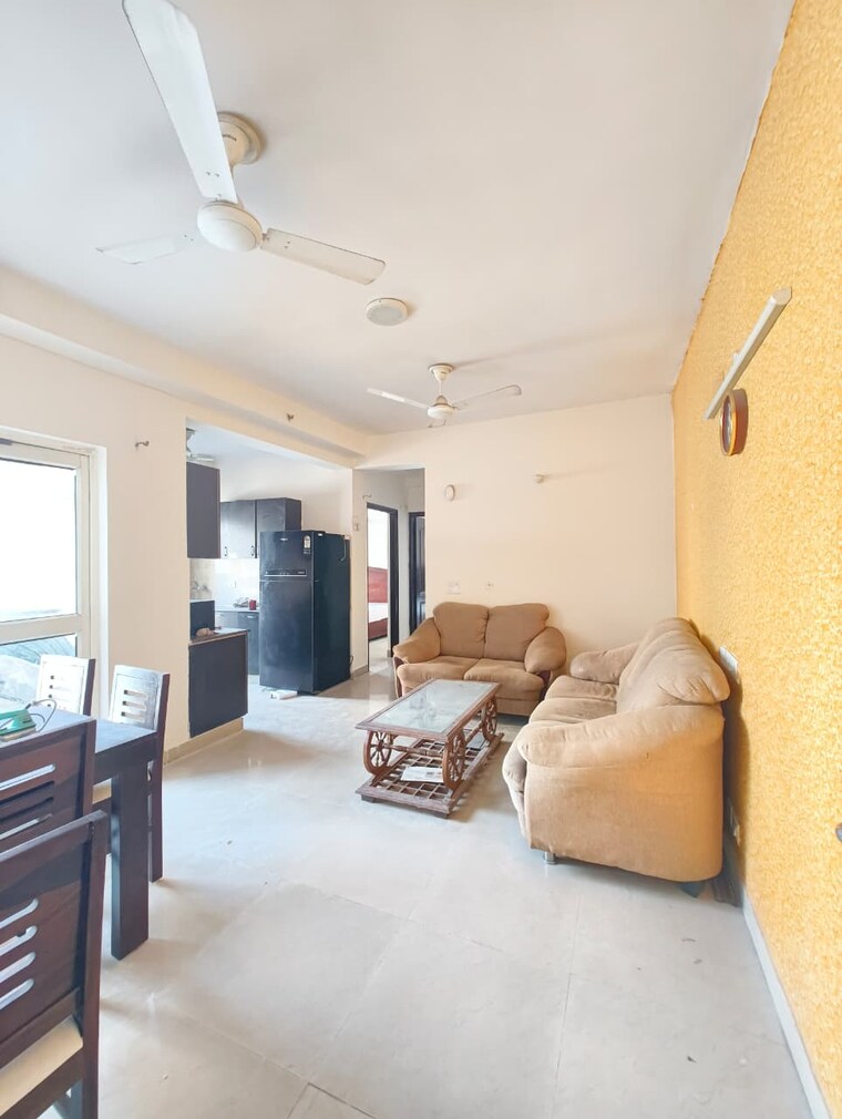 Living Room, aims-golf-city 2 Bedroom 950 Sq.Ft. Apartment In Sector 75 Noida 9835927
