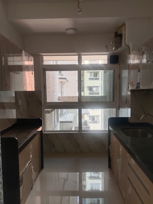 Kitchen in 2 BHK Apartment at Wadhwa TW Gardens, Kandivali East – for Rent