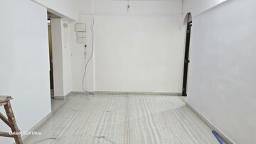 Living Room in 2 BHK Apartment at Atlanta CHS, Malad West – for Rent