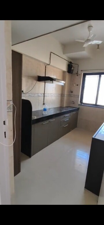 Kitchen in 2 BHK Apartment at K Raheja Palm Spring, Malad West – for Rent