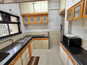 Kitchen in 2 BHK Apartment at Godrej Edenwoods, Manpada – for Rent