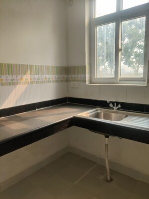 Kitchen in 4 BHK Apartment at The Divyalok Apartment, Sector 21d – for Sale