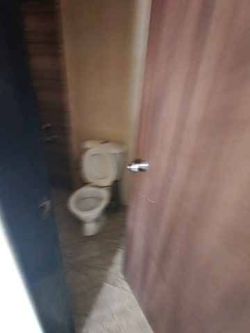 Bathroom in 1 BHK Apartment at Spring Grove Uno Society, Kandivali East – for Rent